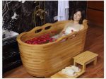 wooden bathtub with handrails and headset