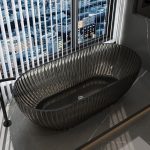 grey oval transparent resin bathtub with textured exterior